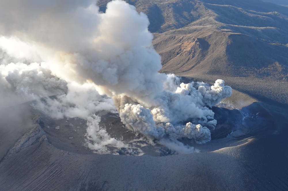 An aerial view shows Shinmoedake peak erupting between Miyazaki and Kagoshima prefectures, southwestern Japan, in this photo taken by Kyodo March 6, 2018. Kyodo/via Reuters