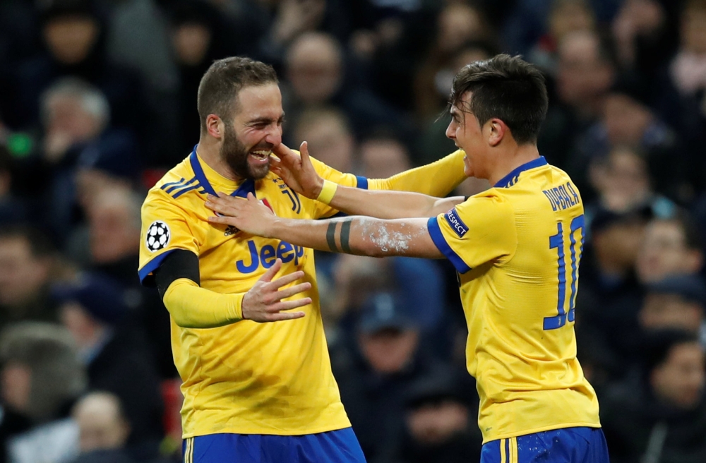 Juventus’ Paulo Dybala celebrates scoring their second goal with Gonzalo Higuain REUTERS/Eddie Keogh
