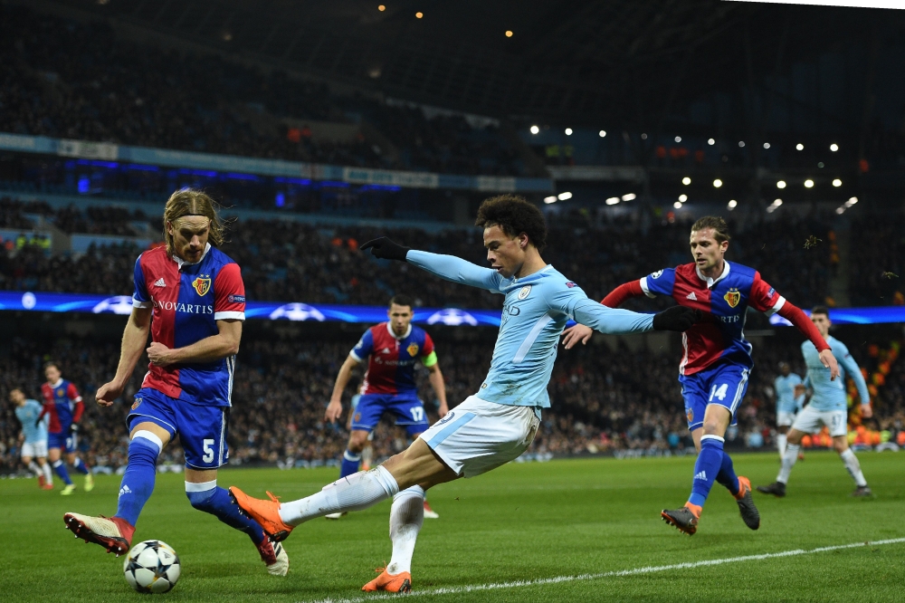 Manchester City's German midfielder Leroy Sane crosses the ball during the UEFA Champions League round of sixteen second leg football match between Manchester City and Basel at the Etihad Stadium in Manchester, north west England, on March 7, 2018. / AFP 