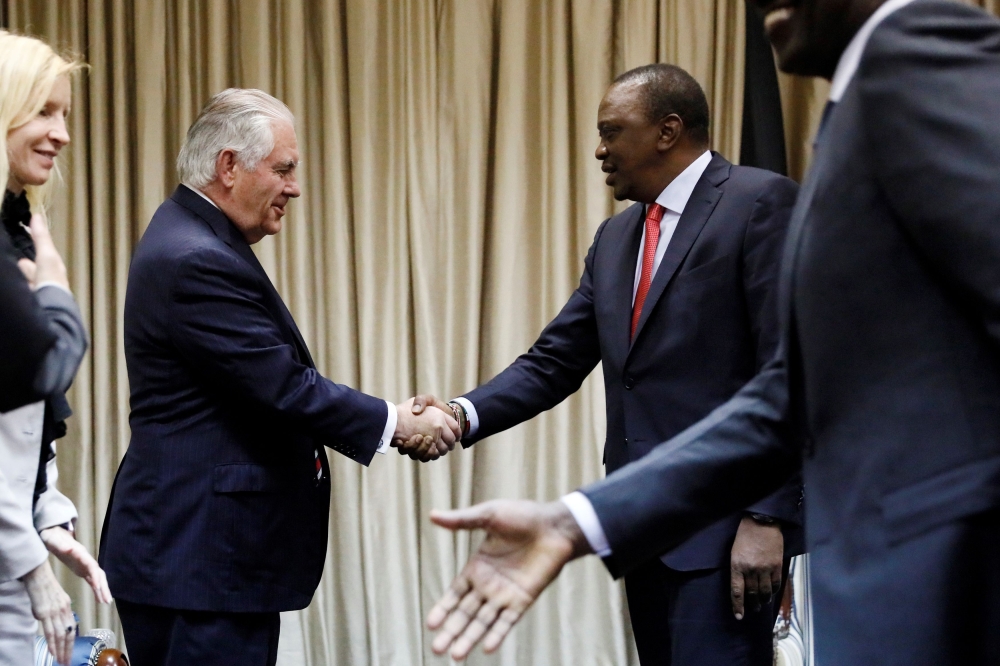 Kenya's President Uhuru Kenyatta (R) greets U.S. Secretary of State Rex Tillerson and his delegation prior to a meeting at the State House in Nairobi, on March 9, 2018. AFP / X90178 / Jonathan Ernst

