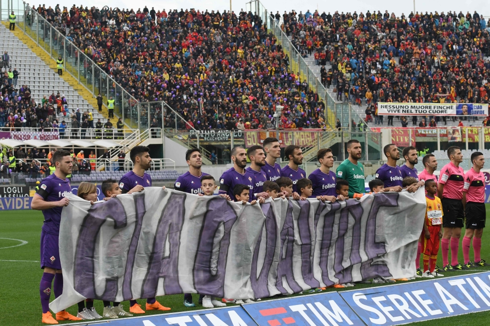 Fiorentina's player hold a banner 