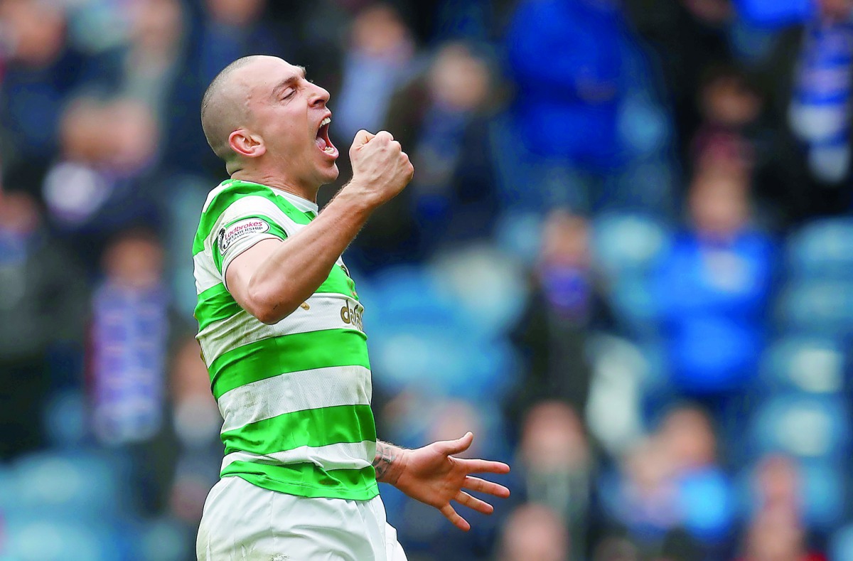 Celtic’s Scott Brown celebrates after the match, Ibrox, Glasgow, Britain,  March 11, 2018  Reuters/Russell Cheyne