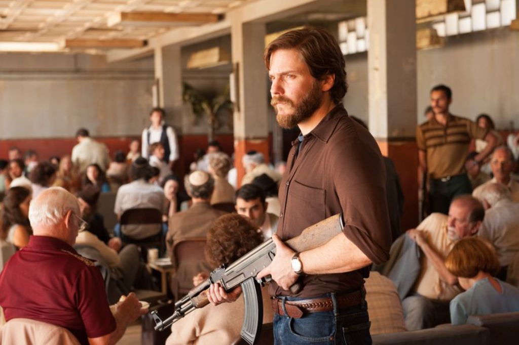 A still of the actor Daniel Bruhl (C) from the movie 7 Days in Entebbe. 