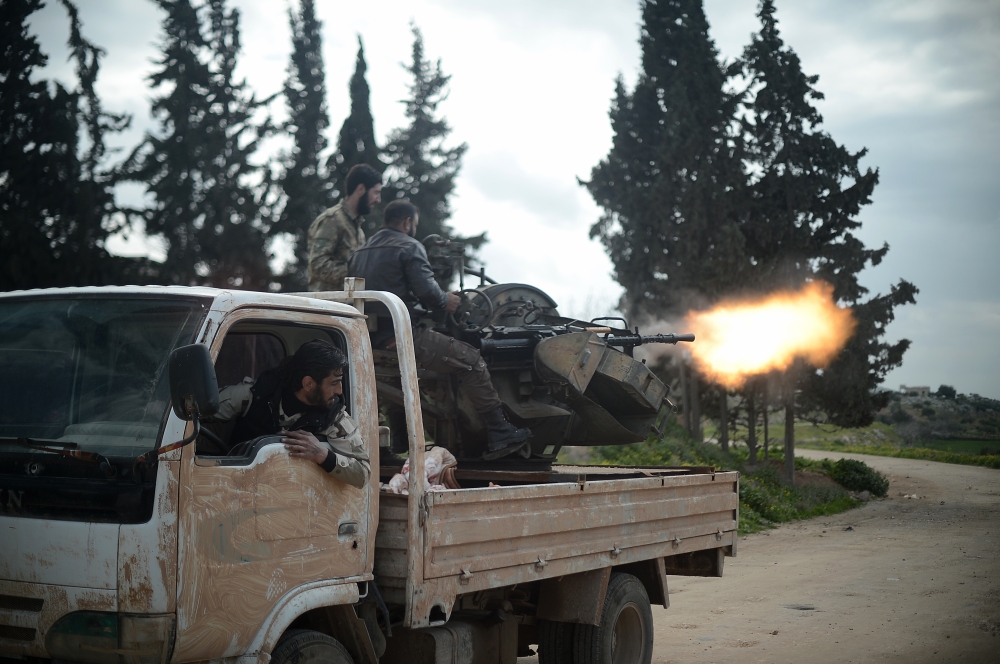 Members of Free Syrian Army (FSA), backed by Turkish Armed Forces, fire to hit YPG/PKK-Daesh terrorists positions within the 