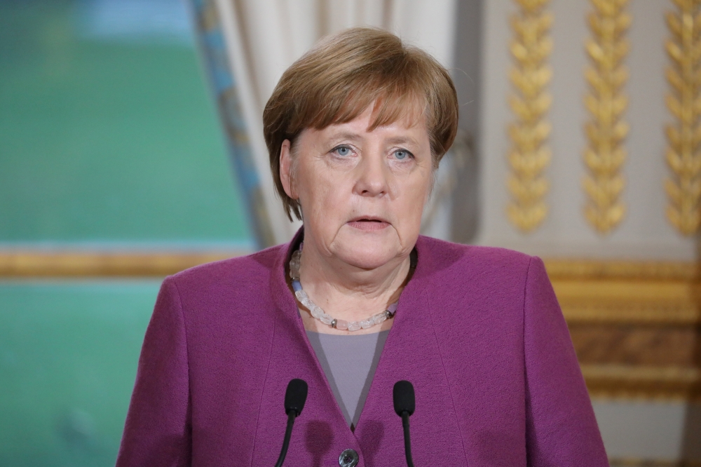 German Chancellor Angela Merkel gives a joint press conference with France's President at the Eylsee presidential Palace in Paris, France March 16, 2018. Ludovic Marin/Pool via REUTERS
