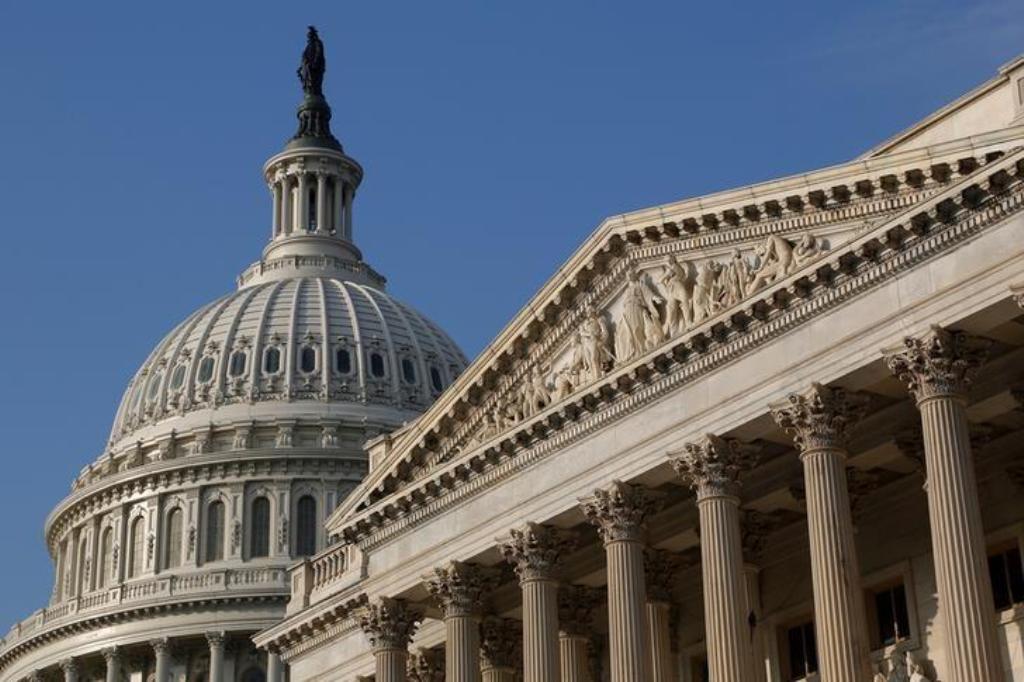 FILE PHOTO: The U.S. Capitol Dome (L) building is pictured in Washington, DC, U.S. on October 4, 2013. REUTERS/Jonathan Ernst
