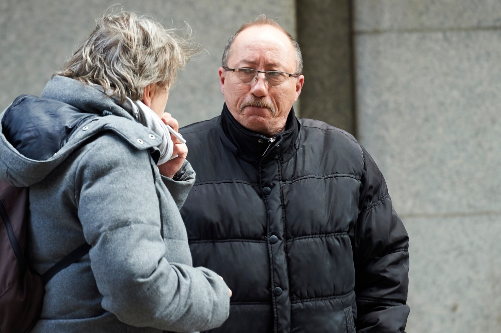 Stephane Devallonne (R), stepfather of murdered French au-pair Sophie Lionnet, leaves the Old Bailey, London's Central Criminal Court, in central London on March 19, 2018.  AFP / Niklas Halle'n
