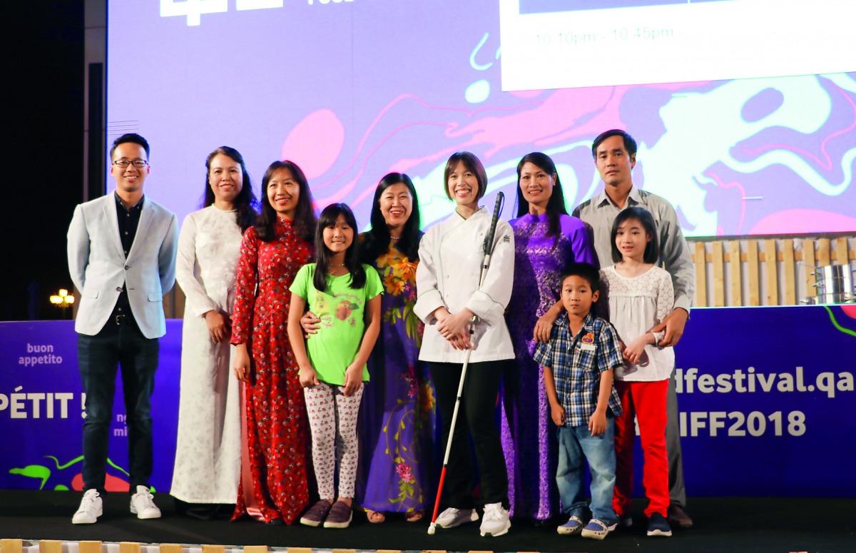 American chef, author and TV host Christine Ha at the QIFF 2018 Cooking Theatre with some members of the Vietnamese Embassy and community.