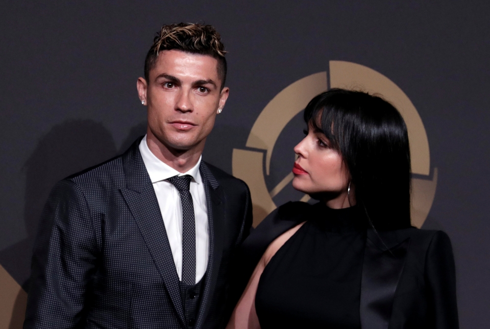 Portuguese soccer player Cristiano Ronaldo and his girlfriend Georgina Rodriguez arrive at the Quina Awards ceremony in Lisbon, Portugal, March 19, 2018. REUTERS/Rafael Marchante
