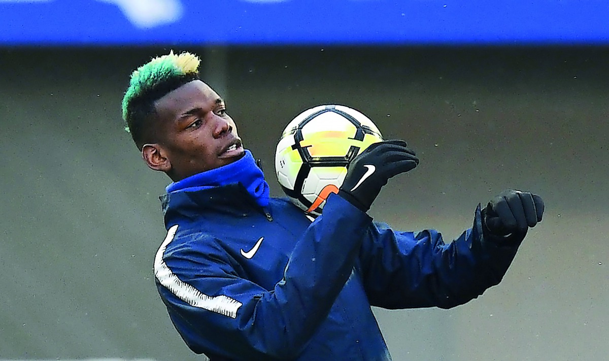 France's midfielder Paul Pogba controls the ball during a training session in Clairefontaine-en-Yvelines, southwest of Paris, on March 19, 2018, as part of the team's preparation for the friendly football matches against Colombia and Russia.  AFP / Franck