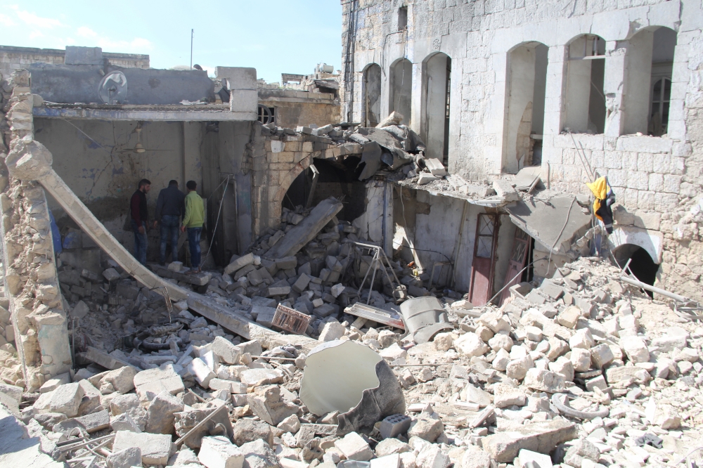 A collapsed building is seen after Assad Regime forces carried out an airstrike over the de-escalation zone of Maarrat al-Nu'man district of Idlib, Syria on March 17, 2018. Mohmad Adaher - Anadolu
