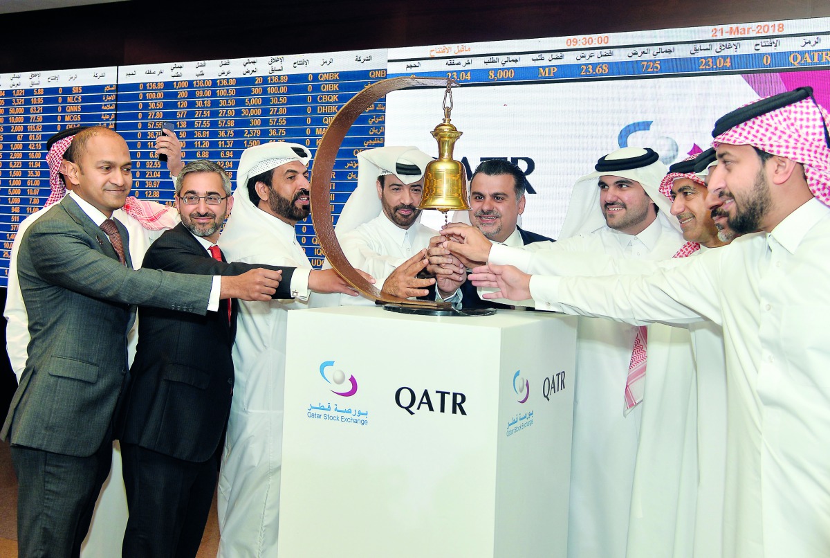 Rashid bin Ali Al Mansoori (third left), CEO, Qatar Stock Exchange; Haithem Al Katerji (center), Chief investment officer at Al Rayyan Investment; Akber Khan (second left) Senior Director-Asset Management, Al Rayyan Investment Group; along with other offi