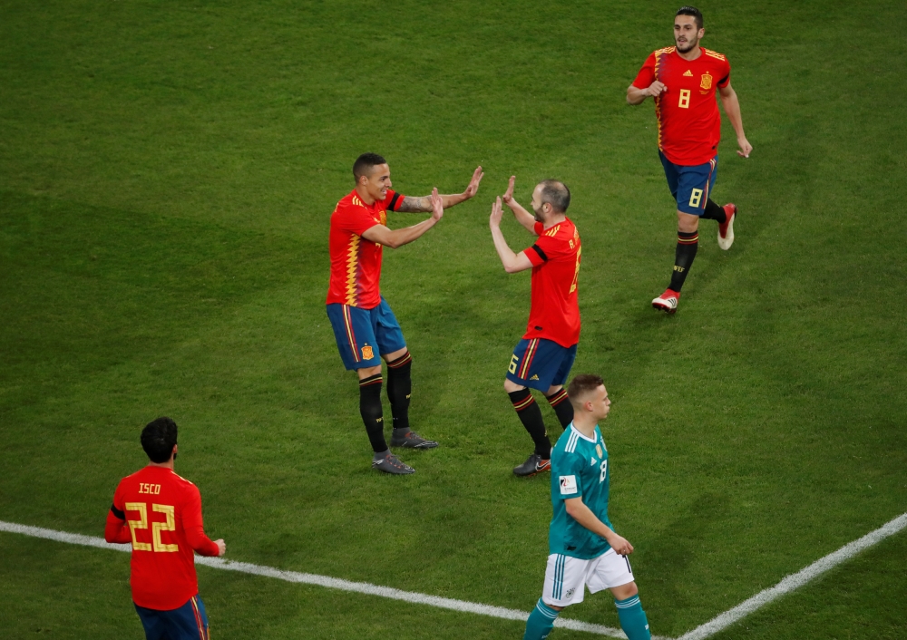 Spain’s Rodrigo celebrates with Andres Iniesta after scoring their first goal REUTERS/Wolfgang Rattay
