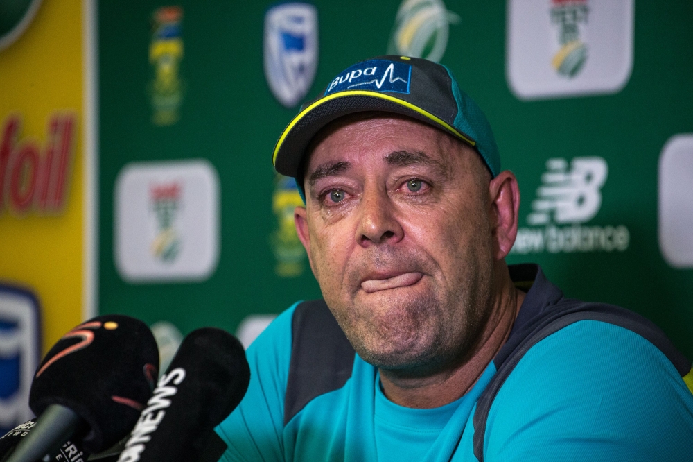 Darren Lehmann speaks to the press as he announces he will resign as Australian cricket coach after the coming Test match on March 29, 2018 in Johannesburg. / AFP / WIKUS DE WET