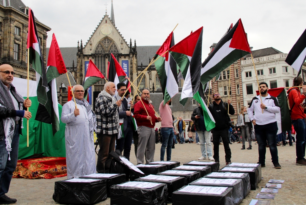 Model coffins, that the names of the 15 Palestinians, who were martyred in Gaza Strip are written, are seen during a demonstration at Dam Square as part of the Palestine's ‘Land Day’ in Amsterdam, Netherlands on March 31, 2018. (Abdullah A??ran - Anadolu 
