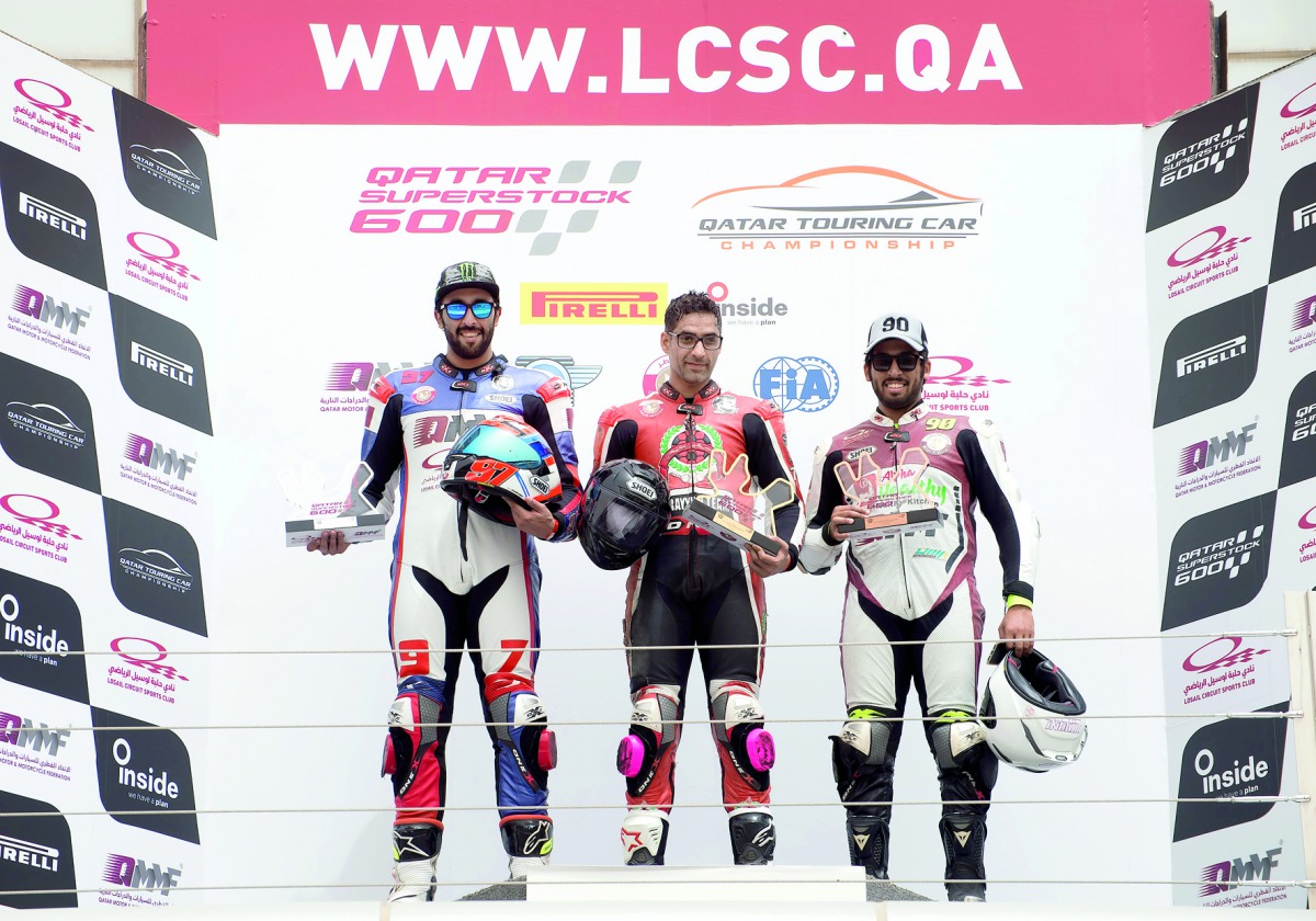 The podium winners  pose for a photo yesterday at Losail International Circuit. 