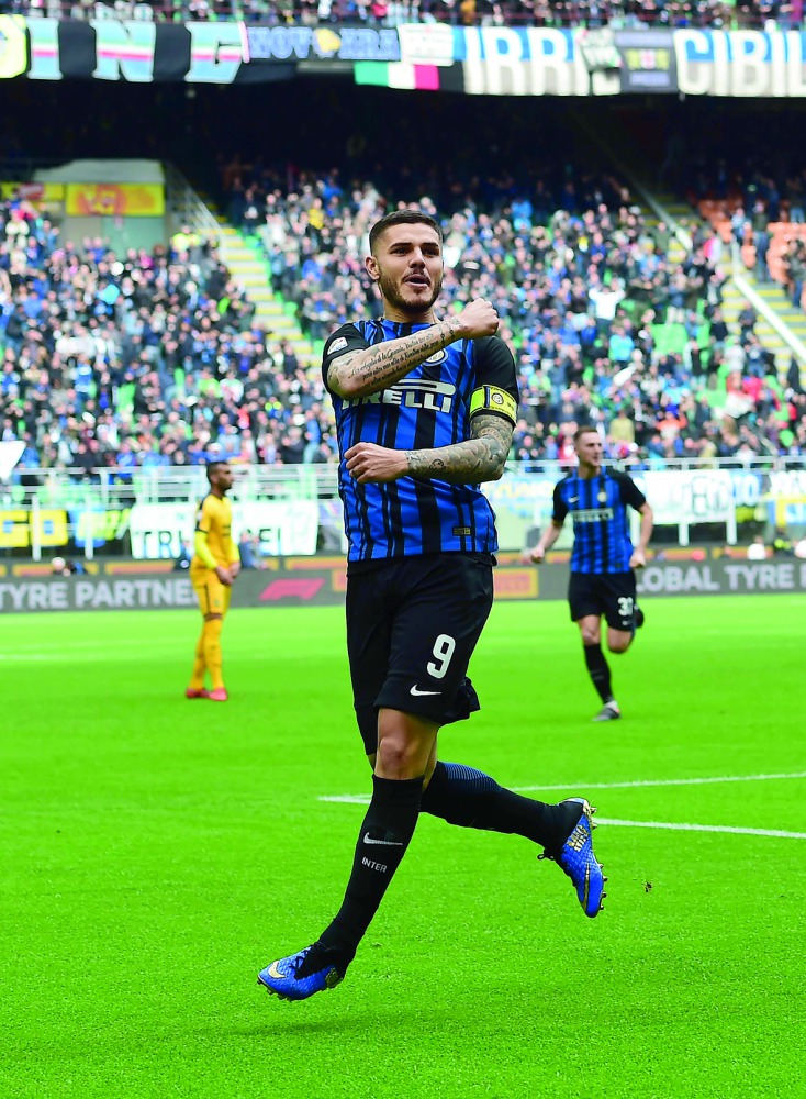 Inter Milan's captain Argentinian forward Mauro Icardi celebrates after scoring his 101st goal during the Italian Serie A football match Inter Milan vs Hellas Verona at the San Siro stadium in Milan on March 31, 2018. AFP / Miguel Medina