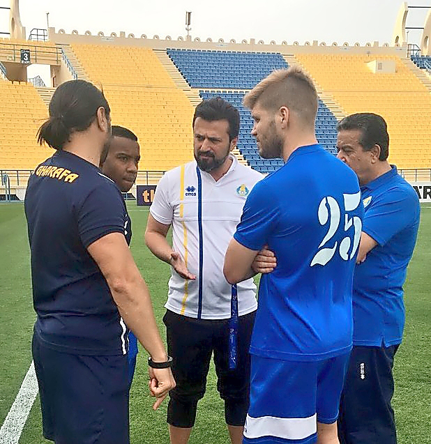 Al Gharafa’s coach Bulent Uygun speaks to his players and coaching staff during a training session on the eve of their AFC Champions League clash against UAE’s Al Jazira yesterday.
