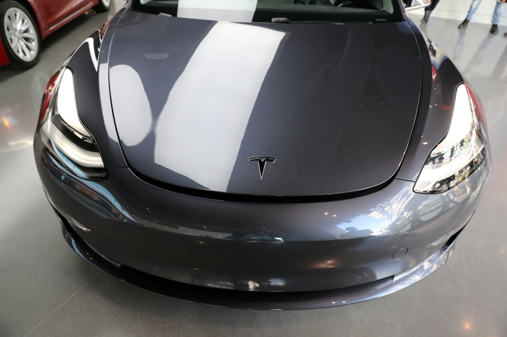 A Tesla Model 3 is seen in a showroom in Los Angeles, California, U.S. January 12, 2018. REUTERS/Lucy Nicholson/File Photo
