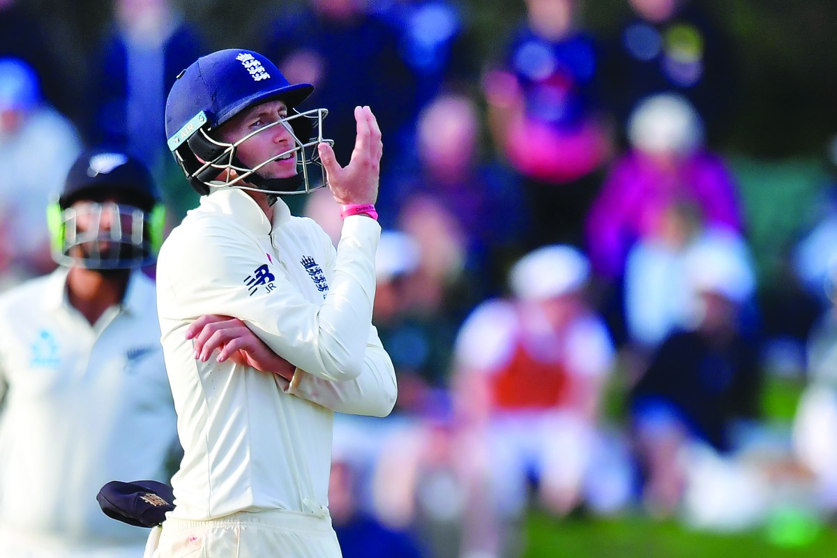 England's Joe Root watches a dropped catch during day five of the second cricket Test match between New Zealand and England at Hagley Oval in Christchurch on April 3, 2018. AFP / Marty Melville