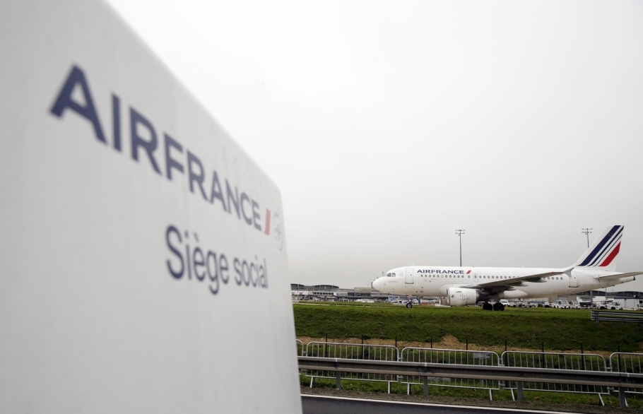 (FILE PHOTO) Sign of Air France at the entrance of the company headquarters, in Roissy-en-France, during a demonstration of Air France workers, ahead an announcement of a restructuring plan by the company. AFP / KENZO TRIBOUILLARD