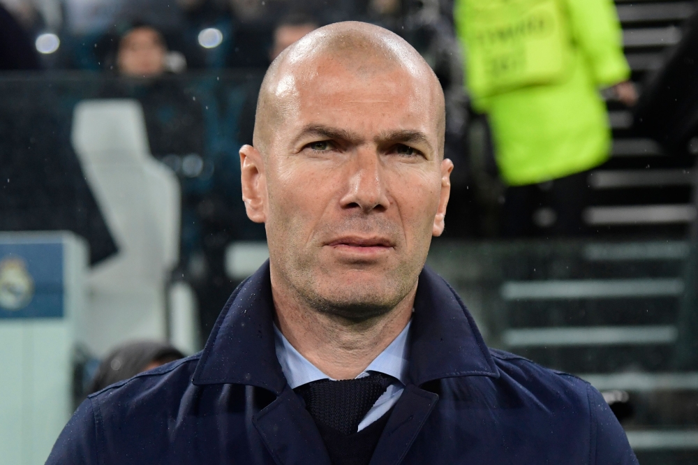 Real Madrid's French coach Zinedine Zidane attends the UEFA Champions League quarter-final first leg football match between Juventus and Real Madrid at the Allianz Stadium in Turin on April 3, 2018. / AFP / JAVIER SORIANO