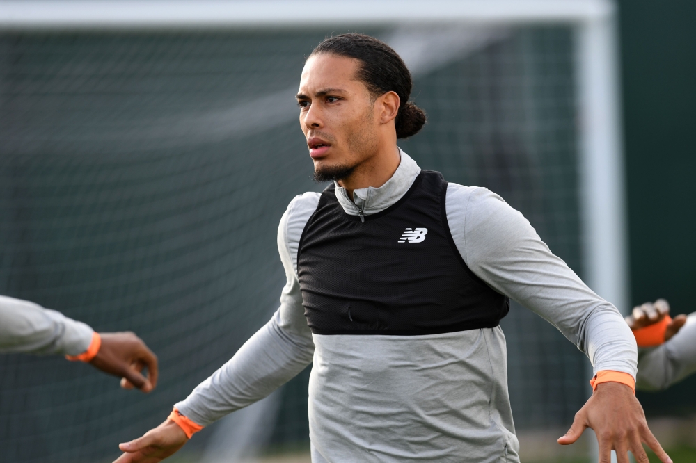 Liverpool's Dutch defender Virgil van Dijk attends a team training session on the eve of the UEFA Champions League first leg quarter-final football match between Liverpool and Manchester City, at Melwood Training Ground in Liverpool, north west England on