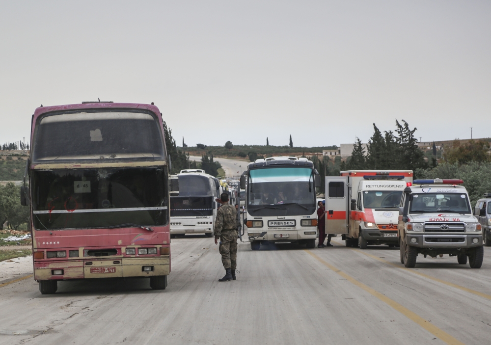 Vehicles of 17th convoy carrying civilians from Syria’s Eastern Ghouta district, arrive in Al-Bab district escorted by ambulances, in Aleppo in Syria on April 10, 2018. Beha el Halebi - Anadolu