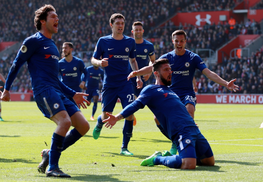 Chelsea's Olivier Giroud celebrates scoring their third goal with Marcos Alonso, Cesar Azpilicueta and team mates REUTERS/Ian Walton 