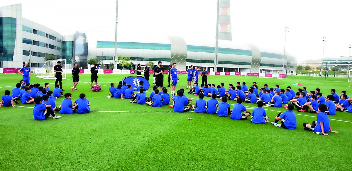 Young players attend the Chelsea Foundation coaching clinic session in Doha. 