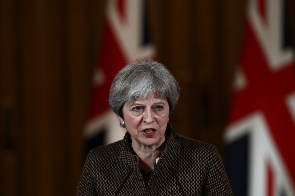 Britain's Prime Minister Theresa May gives a press conference at Downing Street in central London on April 14, 2018 following British military action against Syria. AFP / SIMON DAWSON