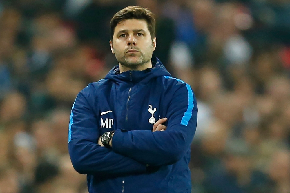 Tottenham Hotspur's Argentinian head coach Mauricio Pochettino watches from the touchline during the English Premier League football match between Tottenham Hotspur and Manchester City at Wembley Stadium in London, on April 14, 2018.  / AFP / Ian KINGTON 