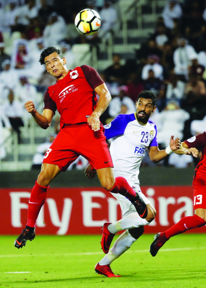 Al Rayyan’s Qatari forward Sebastian Soria (left) leaps for the ball during the Asian Champions League football match at Jassim Bin Hamad Stadium in Doha yesterday.