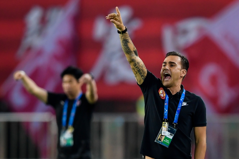 Guangzhou Evergrande's head coach Fabio Cannavaro gestures during the AFC Champions League group stage football match between China's Guangzhou Evergrande and Japan's Cerezo Osaka in Guangzhou in China's southern Guangdong province on April 17, 2018. AFP