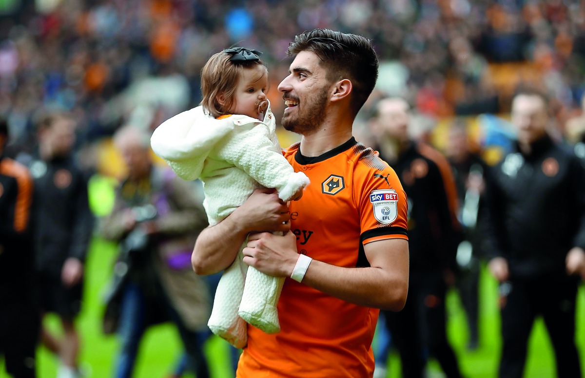 Wolverhampton Wanderers' Ruben Neves celebrates promotion after the match against Birmingham City, April 15, 2018 . Action Images via Reuters/Andrew Boyers