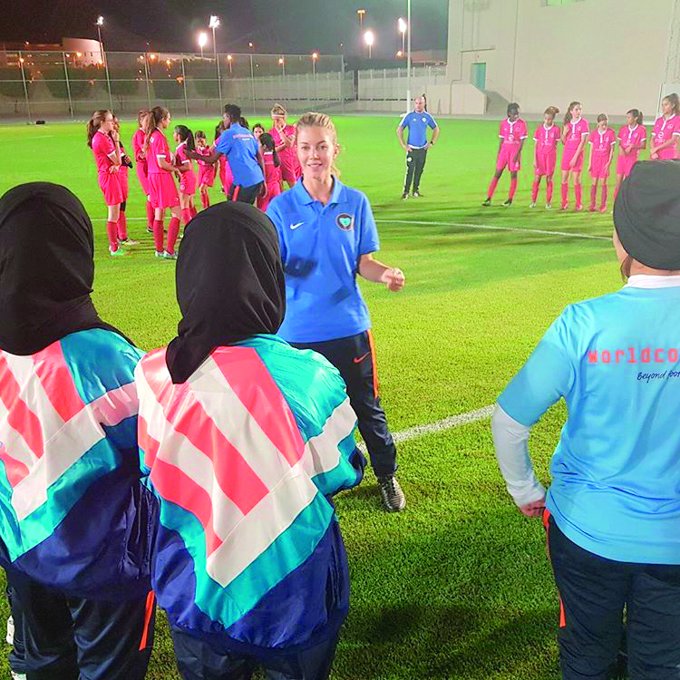 Female coaches and players receive tips during the World Coaches Program of the Royal Netherlands Football Association (RNFA) in Doha. 
