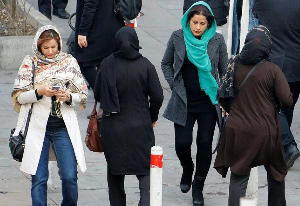 File photo Iranian women wearing hijab walk down a street in the capital Tehran on February 7, 2018. AFP / ATTA KENARE