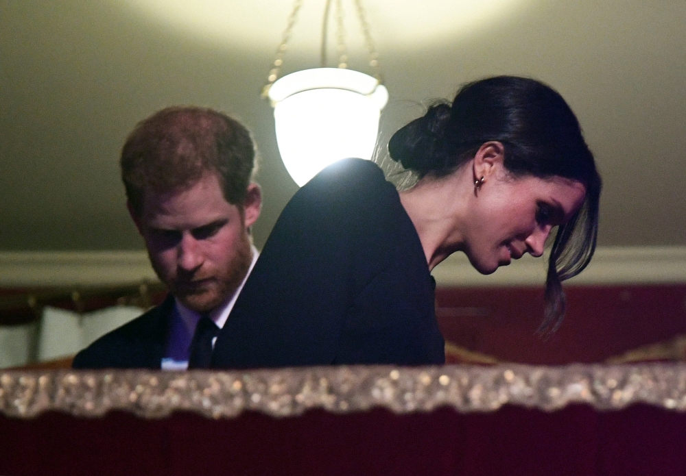 Britain's Prince Harry and Meghan Markle arrive for a special concert 
