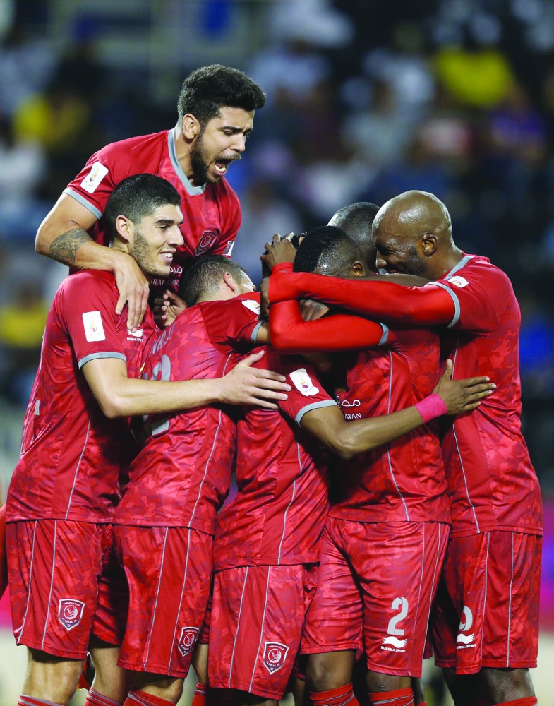 Al Duhail players celebrate after scoring against Al Gharafa in the semi-final of Qatar Cup on Sunday.  