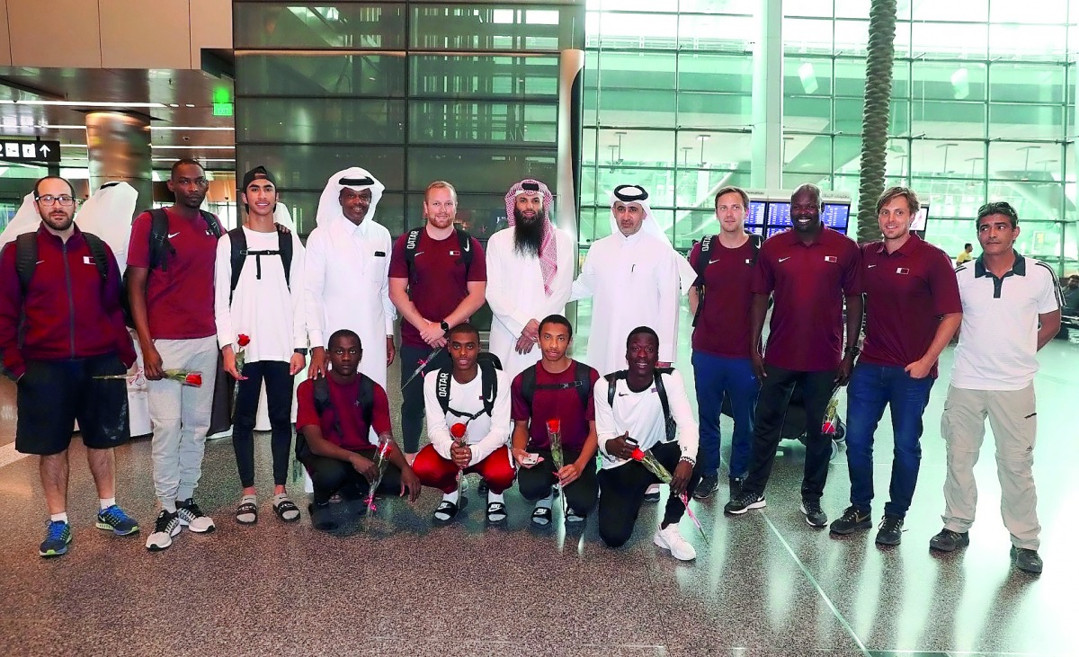 The officials and players of team Qatar pose for a group photo.