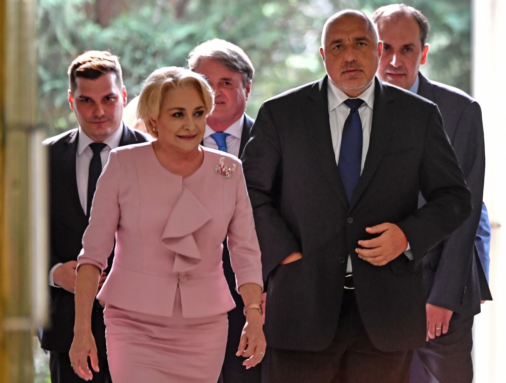 Romanian Prime Minister Viorica Dancila (L) welcomes Bulgarian Prime Minister, Boiko Borisov as he arrives at the Victoria Palace, the Romanian Government headquarters, for a high-level quadrilateral meeting of Romania, Bulgaria, Serbia and Greece on Apri