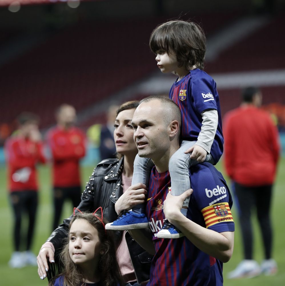 Andres Iniesta of Barcelona celebrates with his wife Anna Ortiz and their childre Paolo Andrea Iniesta Ortiz and Valeria Iniesta Ortiz after Copa del Rey Final soccer match between Sevilla and Barcelona at Wanda Metropolitano Stadium in Madrid, Spain on A