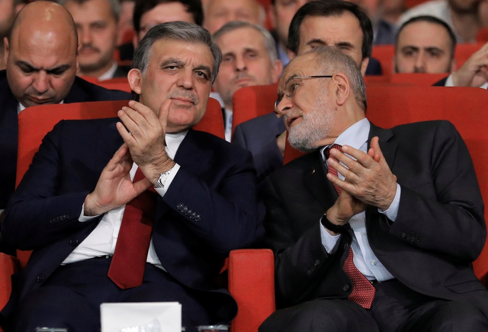 Former Turkish President Abdullah Gul is seen with Saadet Party leader Temel Karamollaoglu during a ceremony in Istanbul, Turkey April 24, 2018. Picture taken April 24, 2018. REUTERS/Huseyin Aldemir