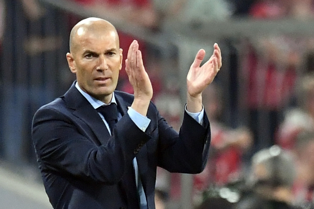 Real Madrid's French coach Zinedine Zidane reacts during the UEFA Champions League semi-final first-leg football match FC Bayern Munich v Real Madrid CF in Munich, southern Germany on April 25, 2018. Germany OUT / AFP / DPA / Matthias Balk