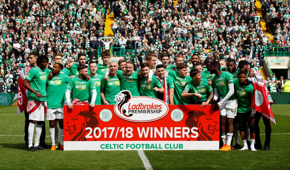 Celtic celebrate after winning the Scottish Premiership. Reuters/Jason Cairnduff
