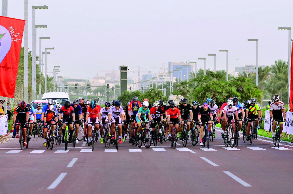 Cyclists seen in action during the final round of the Royal Air Maroc (RAM) League near Al Bidda Park in Doha. BELOW: President of the Qatar Cycling and Triathlon Federation (QCTF) Dr Mohammed Al Kuwari and Adel Khalloufi, Regional Director of Royal Air M