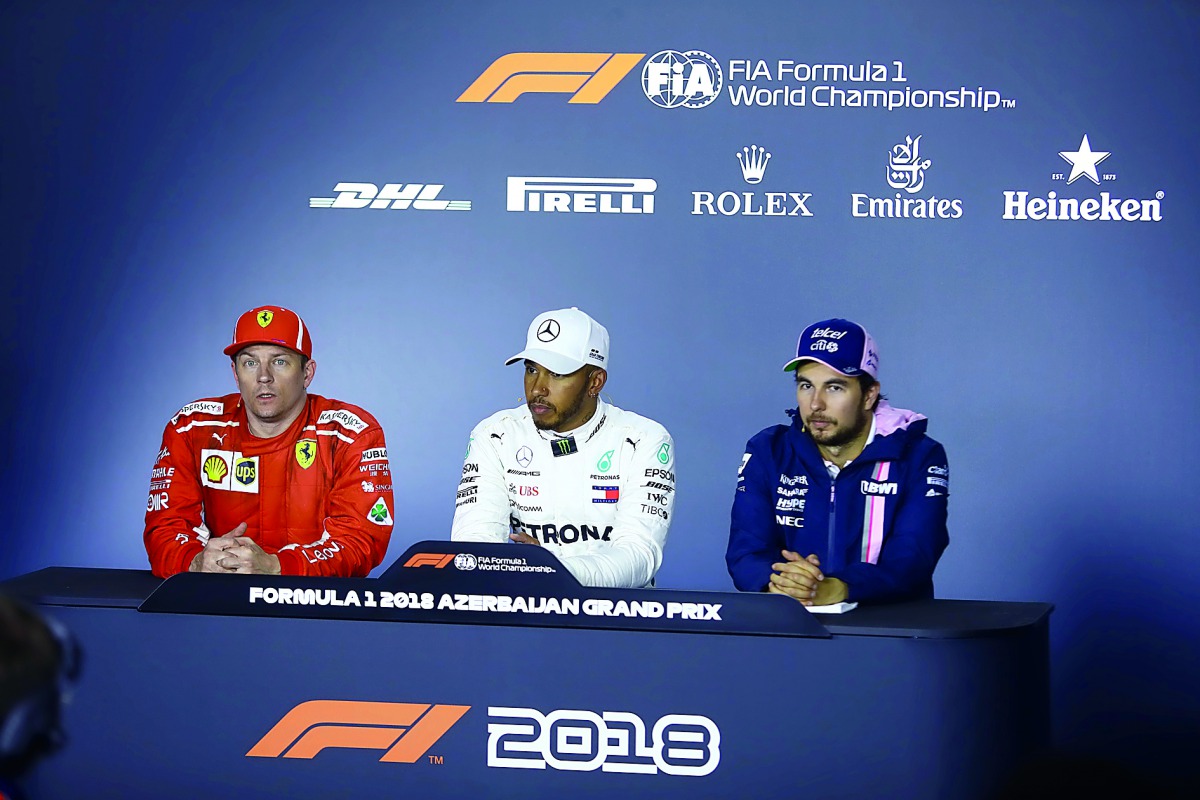 Lewis Hamilton (C) of Mercedes, Kimi Raikkonen (L) of Ferrari and Sergio Perez (R) of Force India hold a press conference at the end of the 4th round of Formula One World Championship Azerbaijan Grand Prix, on April 29, 2018 in Baku, Azerbaijan. (Resul Re