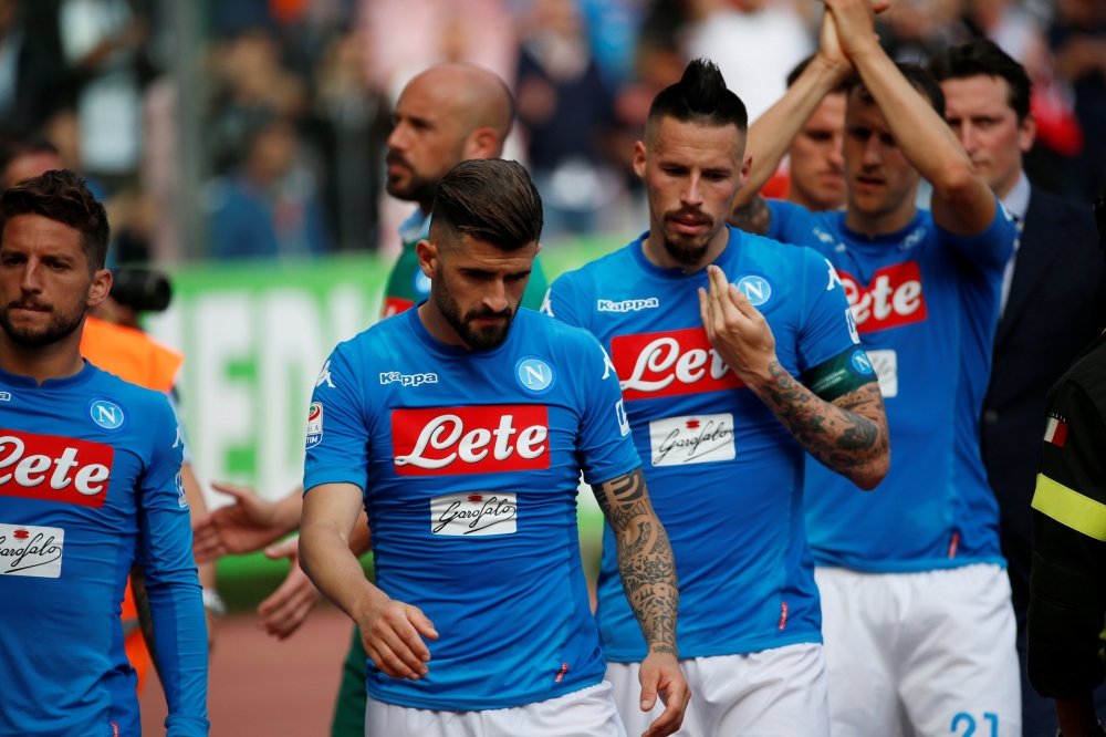 Napoli's Marek Hamsik, Dries Mertens and team mates look dejected at the end of the match REUTERS/Ciro De Luca
