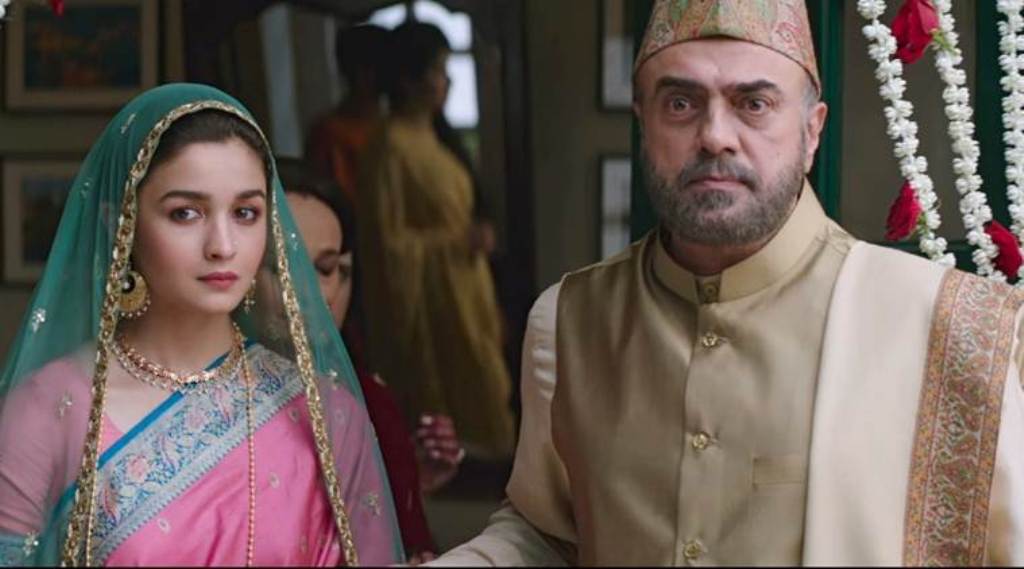 A still of the actors Alia Bhatt and Rajit Kapur from the movie Raazi.