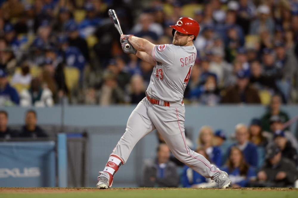 Cincinnati Reds center fielder Scott Schebler (43) watches his three-run home run during the sixth inning against the Los Angeles Dodgers at Dodger Stadium. Orlando Ramirez/USA TODAY Sports